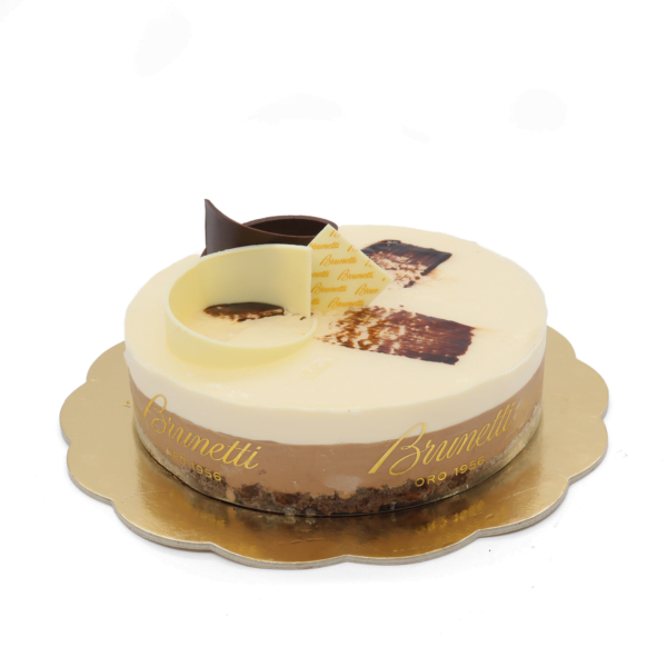 A round brunetti tiramisu cake on a gold cardboard base, with a decorative chocolate swirl and brand logo.