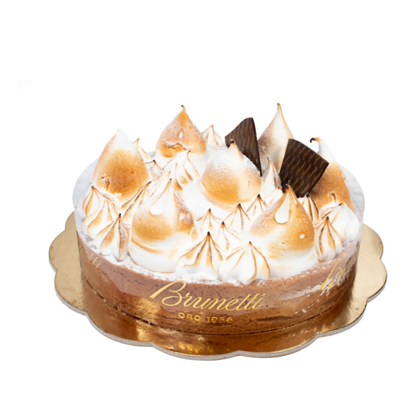 A brunetti branded cake with golden meringue peaks and chocolate shards on a gold cake board, isolated on a white background.