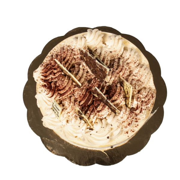 A tiramisu cake with one slice removed, showing layers, on a slate plate against a white background.