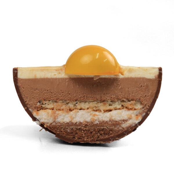 Torta di Pasqua Cut . A cross-section of a layered chocolate dessert with a glossy yellow sphere on top, isolated on a white background.