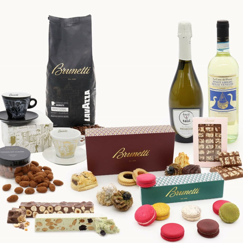 A selection of chocolates, cookies and a bottle of wine.