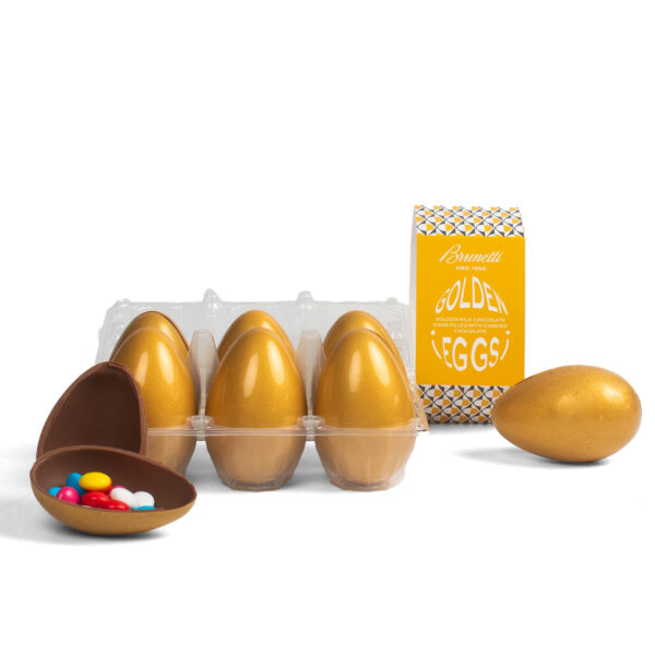 Chocolate easter eggs in plastic packaging with one egg open, revealing colorful candies inside, next to a box labeled "Brunetti golden eggs.