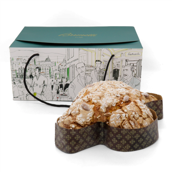 A Traditional Colomba Gift Box next to a loaf of bread.