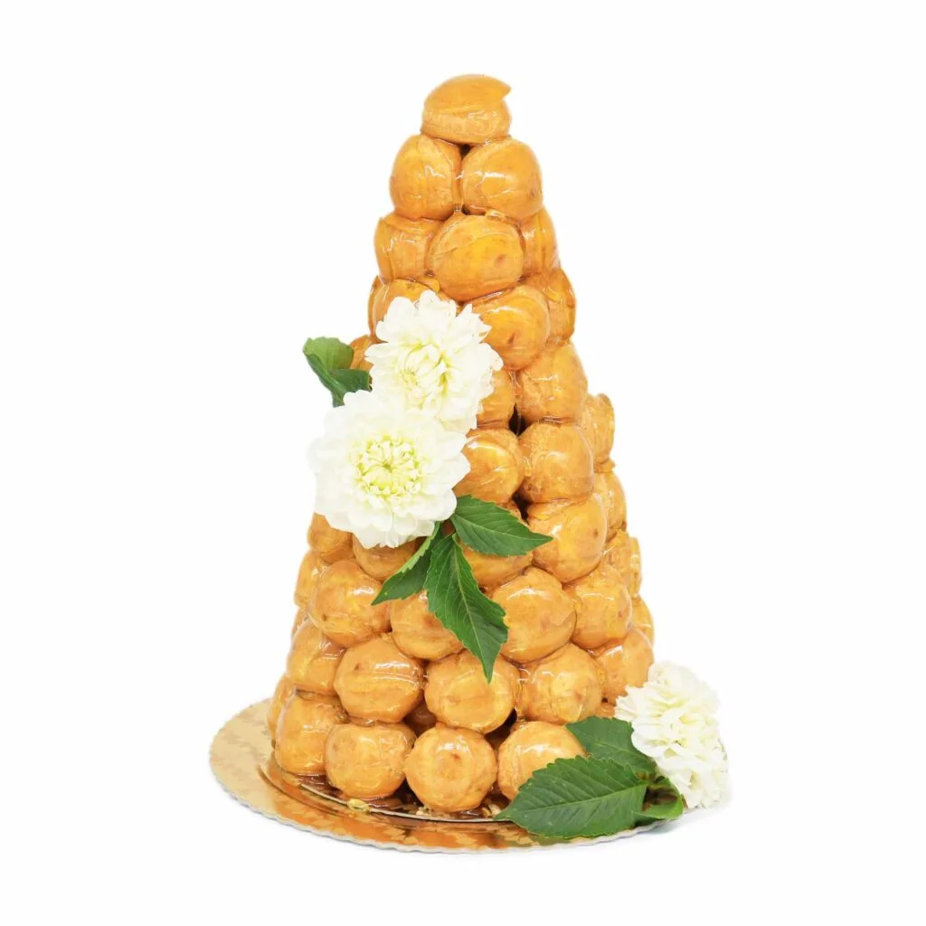 A tower of donuts on a plate.