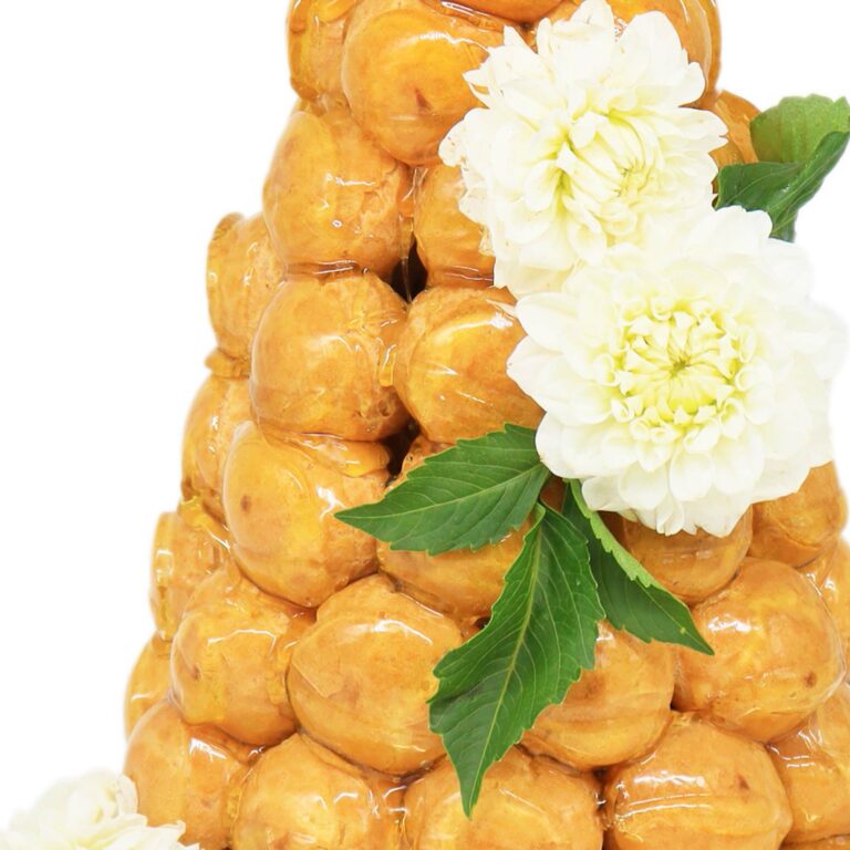 Croquembouche. A stack of donuts with flowers on top.