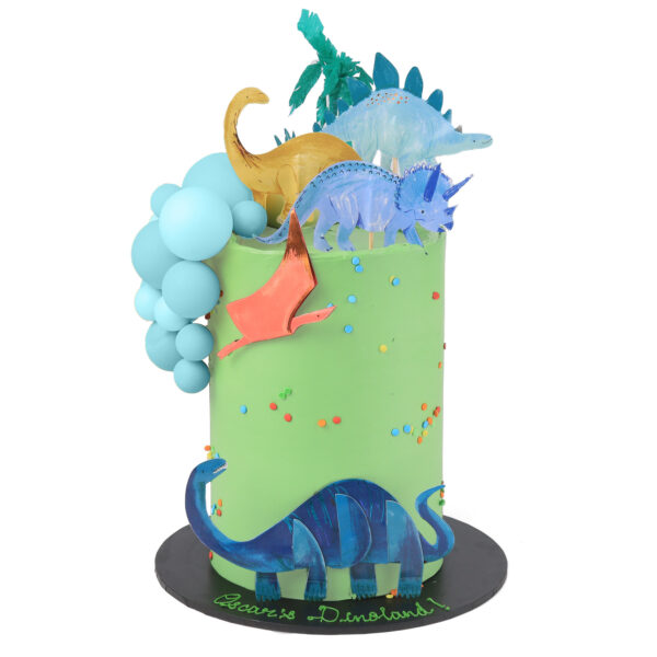 A vividly decorated dinosaur-themed cake featuring a green frosting, dinosaur figurines, and colorful fondant balloons.