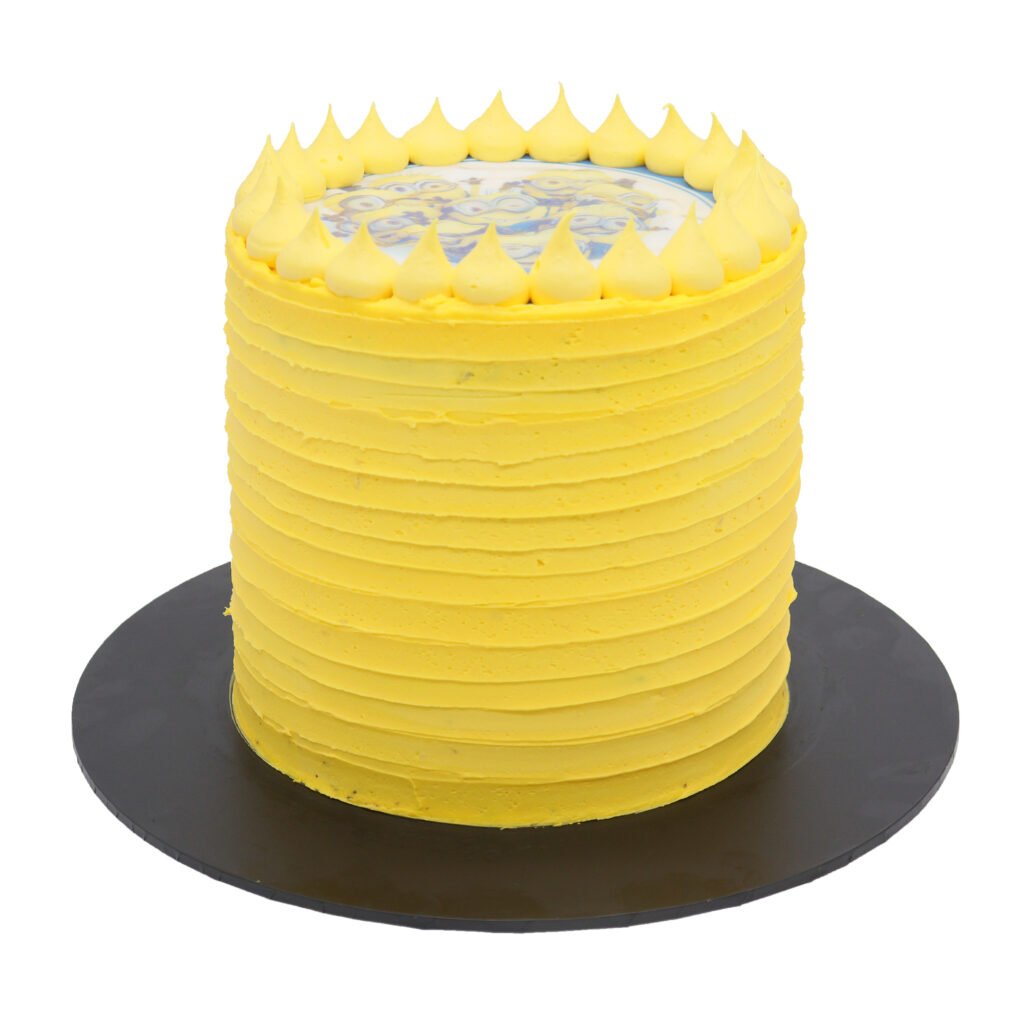 A yellow cake with blue frosting on top.