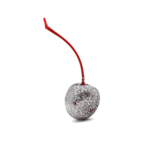 A silver cherry with a red stem on a white background.