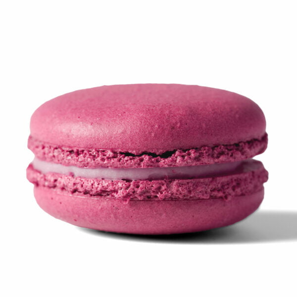 A pink macaron on a white background.