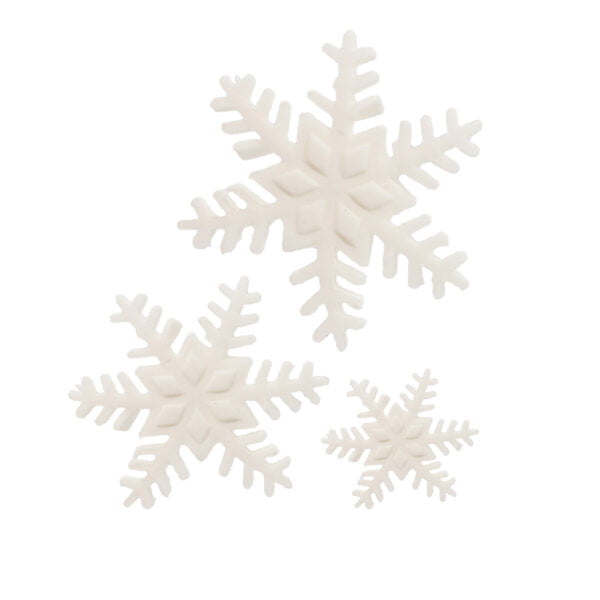 Three white snowflakes on a white surface.