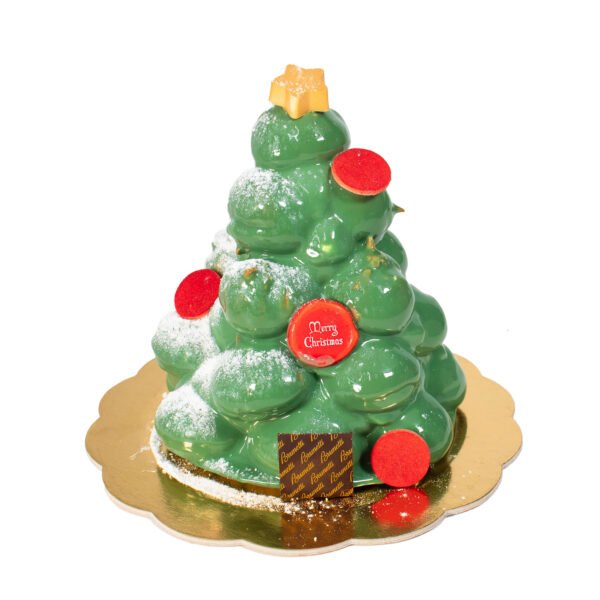 A green cake decorated with Chocolate Baubles, like a Christmas tree.