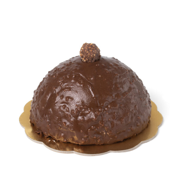 A chocolate dome cake topped with a single Ferrero Rocher, presented on a golden cake board, against a white background.