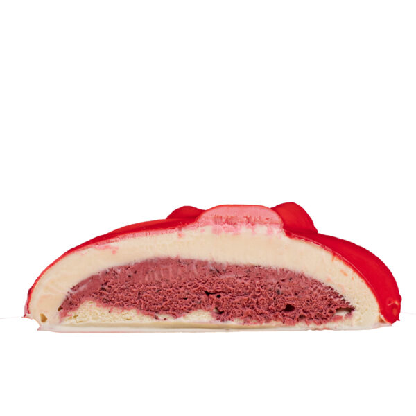 A slice of Ti Amo Valentines Gelato with red outer shell and visible strawberry and vanilla layers inside.