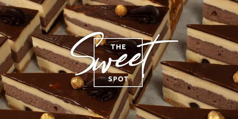 Rows of layered chocolate mousse cake slices topped with dark chocolate ganache and gold decorative elements, with "the sweet spot" text overlay.