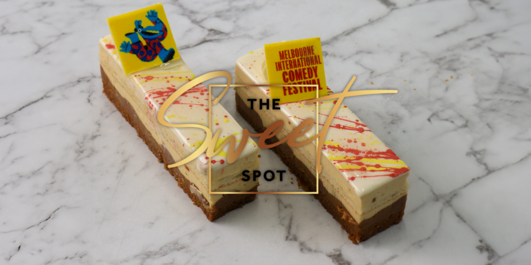 Two slices of vanilla cake topped with cream and yellow sprinkles, placed on a marble surface with the text “the sweet spot” and a logo for a comedy festival.