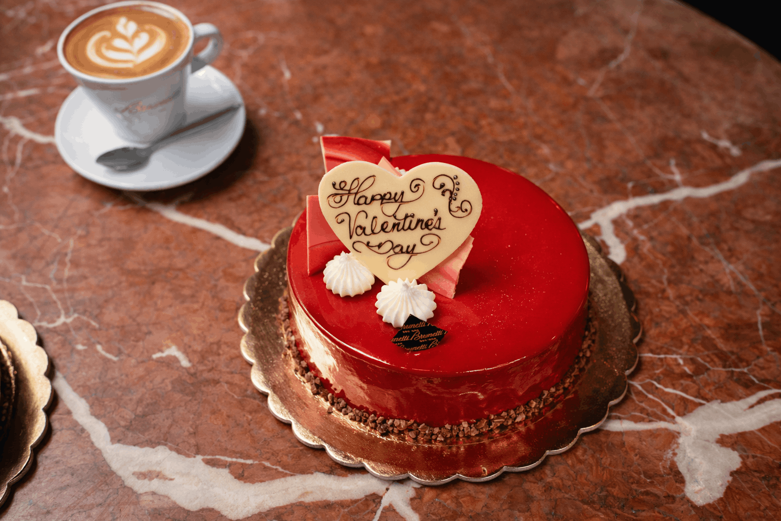 Red Valentine's Day cake with coffee